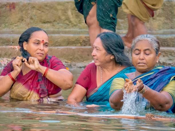 women in holy bath