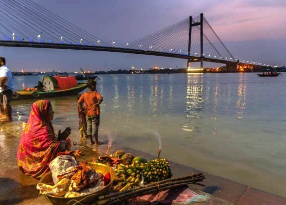 River bank devotions with modern bridge